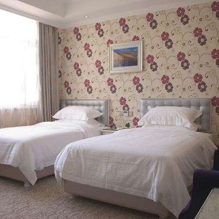 Xinyijia City Hotel Урумчи Экстерьер фото